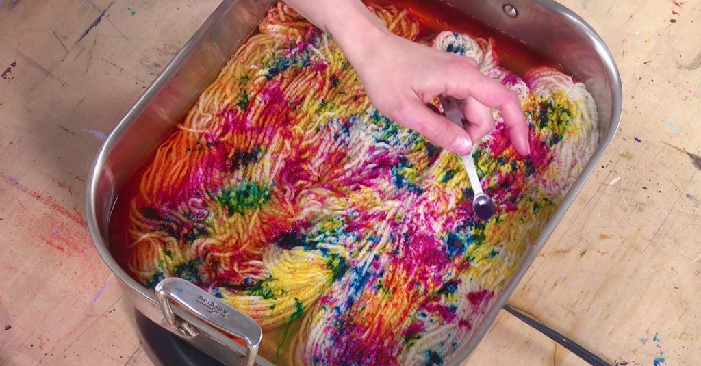 Colorful yarn dying in a pan