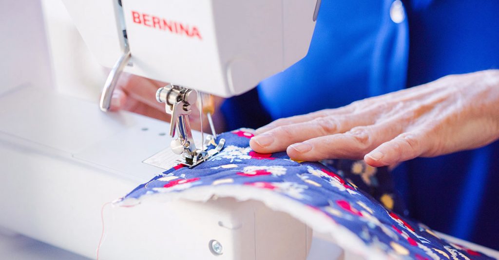 Sewing colorful fabric on a machine