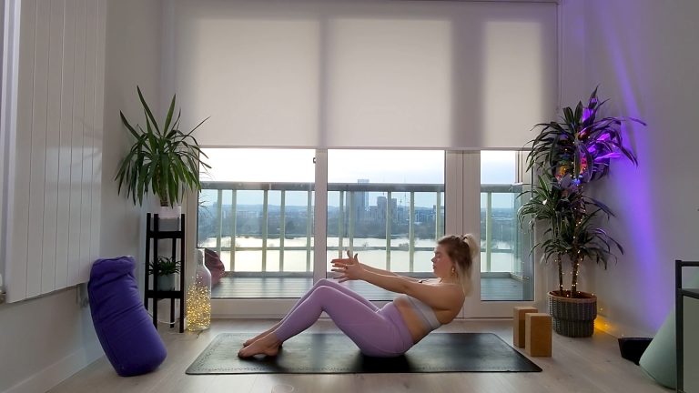 Woman in purple pants doing yoga