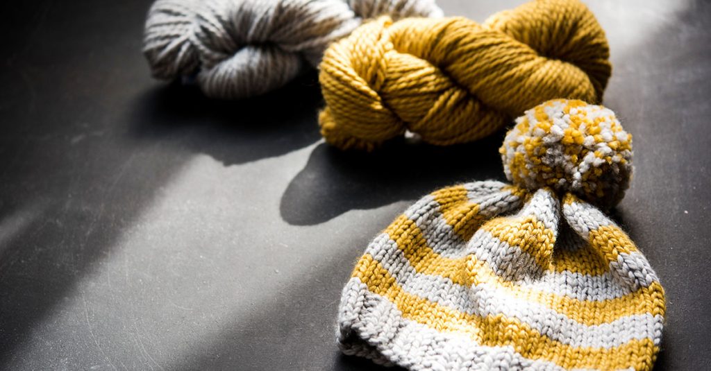 Yellow and grey knit pom hat