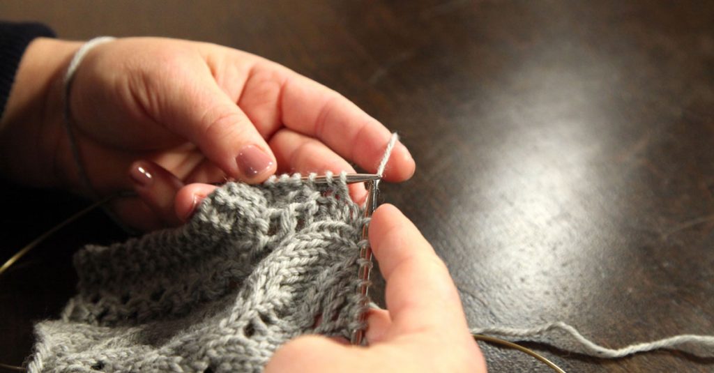 Knitting with grey yarn