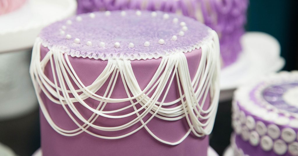 Purple cake with white decorations