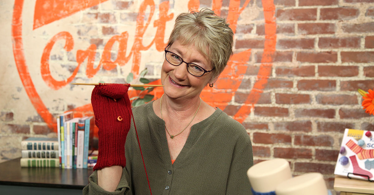 Knitting a red mitten