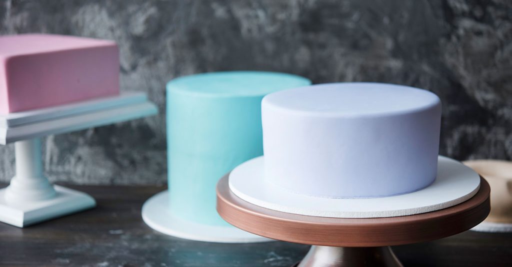 Three different shape fondant covered cakes