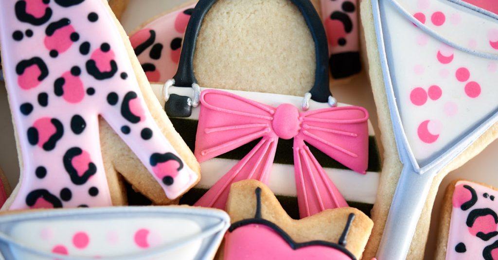 Sugar cookies decorated like shoes, purses and drinks