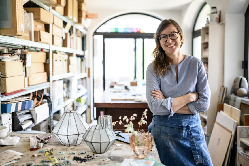 Glass artist craftswoman working in her studio