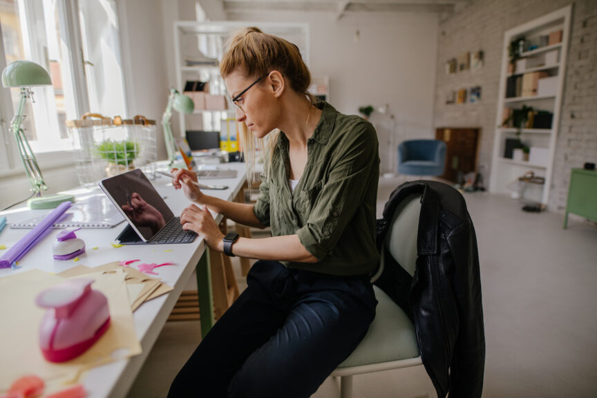 Photo of a woman working from home office