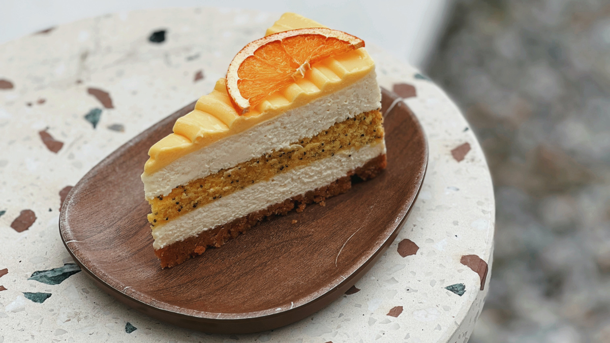 a piece of cake on a wooden plate