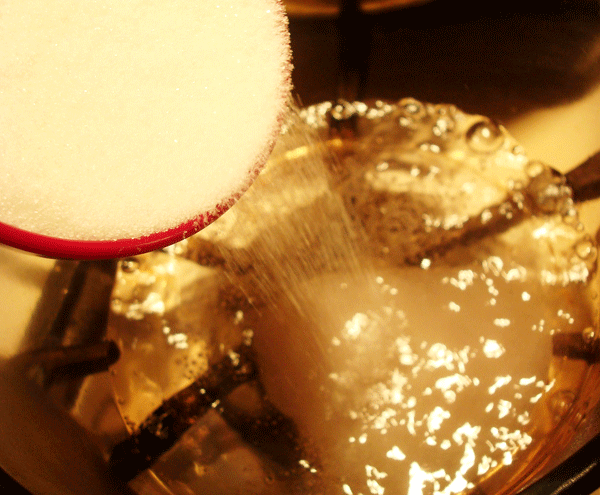 Pouring Sugar into Boiling Water