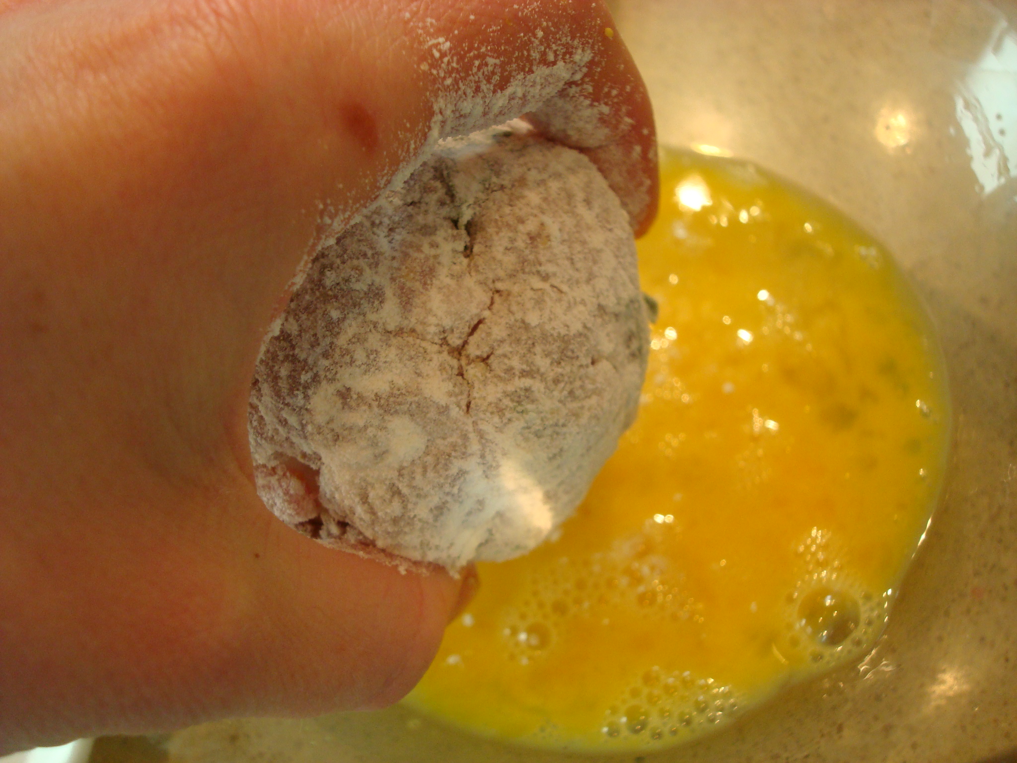 Coating Scotch Eggs in Egg Mixture