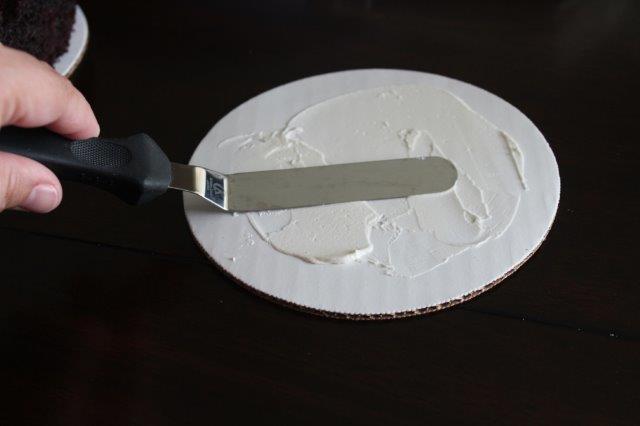 Buttercream Being Spread on a Cake Board with an Offset Spatula