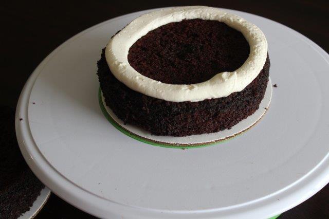 Piped Circle of Buttercream on a Chocolate Cake