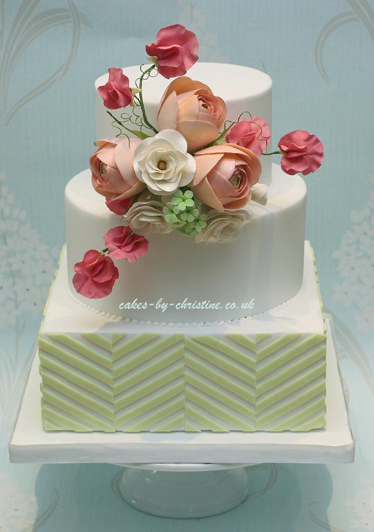 Cake Decorated With Offset Stripes and Sugar Flowers