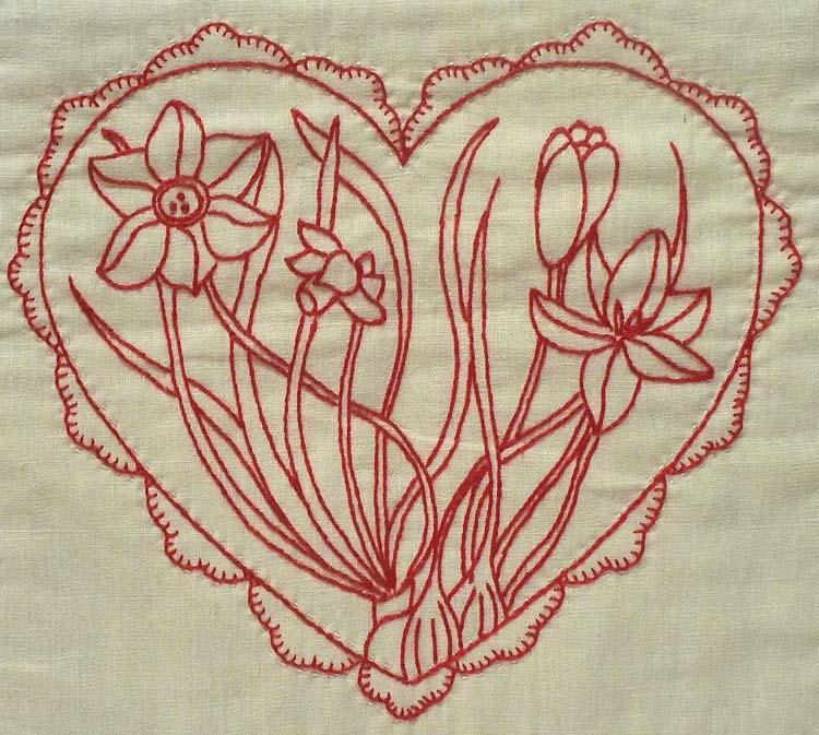 Redwork embroidery of flowers inside a heart