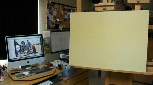 Studio set-up with reference photo, tinted panel, and pencil grid