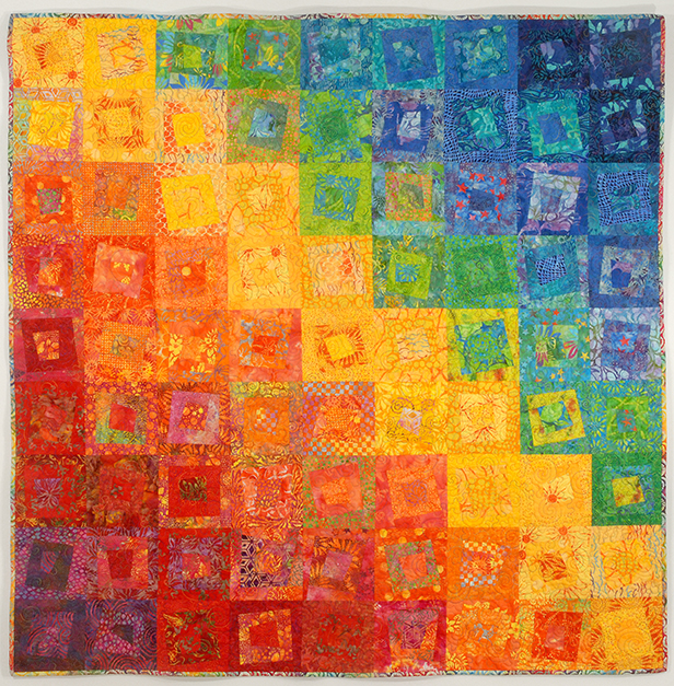 Rainbow quilt using a wide variety of fabrics