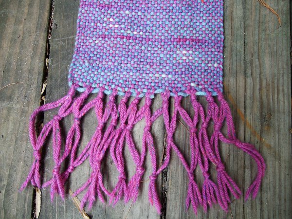 woven scarf with knotted fringe