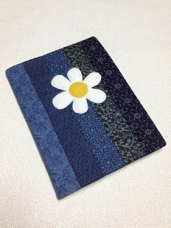 Blue quilt journal with white daisy