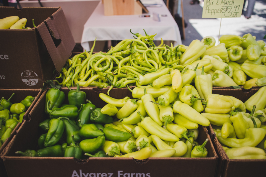 Market baskets full of fresh green peppers 