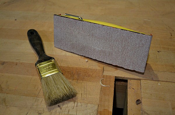 commercially-made sanding block and regular paint brush