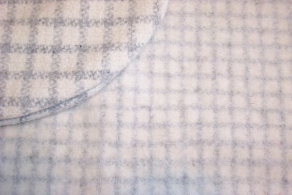 Two fabrics woven identically and fulled differently