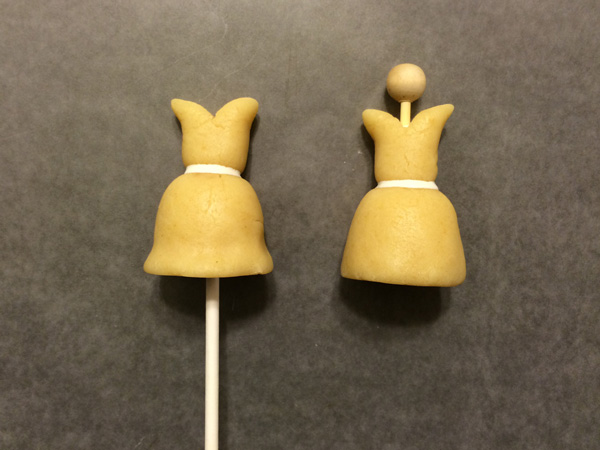 inserting sticks into cake pops