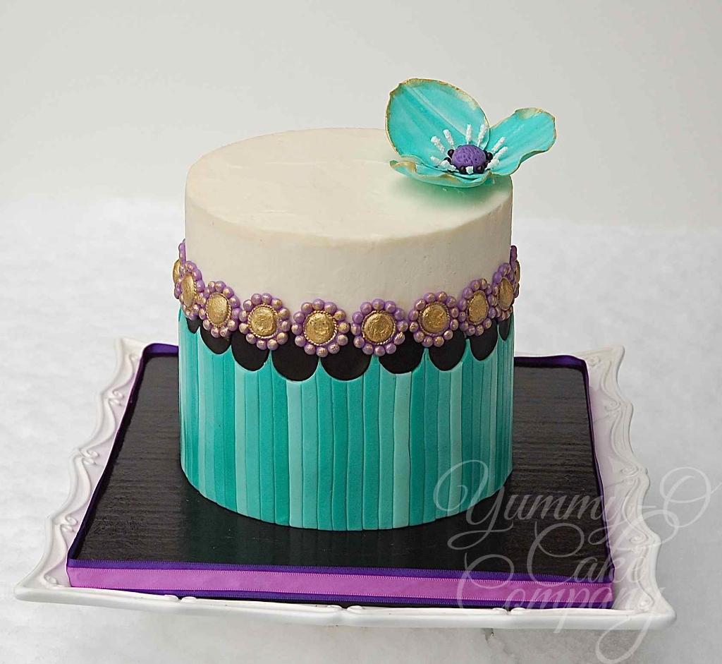 Striped Birthday Cake with Flower Topper. 