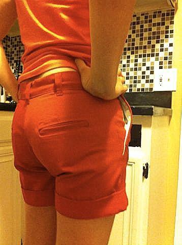 Red-orange denim shorts