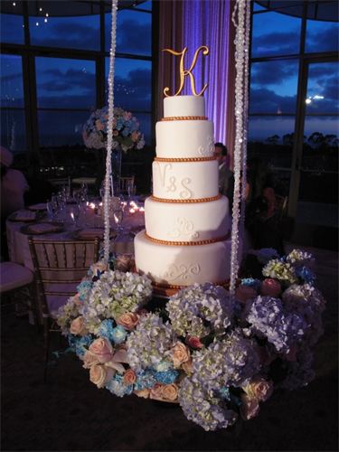 Beautiful wedding cake on a swing by Sweet Cakes by Mel