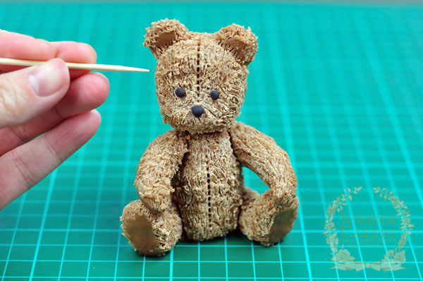 Creating fur on an antique teddy bear from modeling chocolate