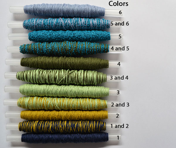 Wound bobbins in a varied colour selection for ombre weaving