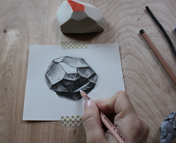 Adding white charcoal to drawing