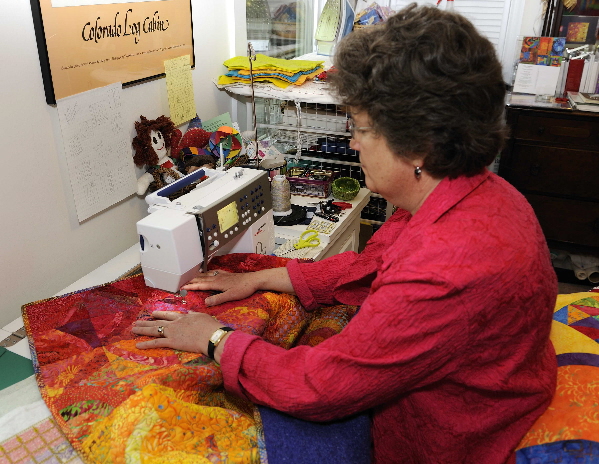 Sitting at the sewing machine with a relaxed posture