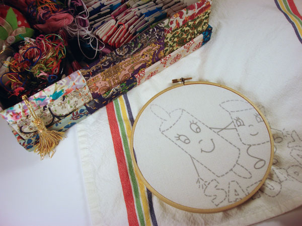 embroidering tea towels