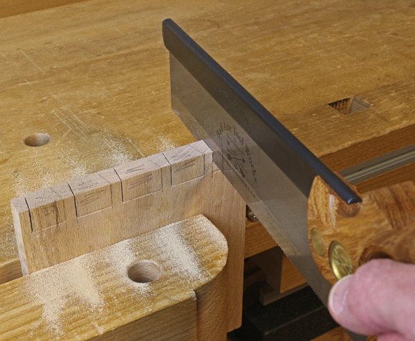 sawing the pins for dovetailing