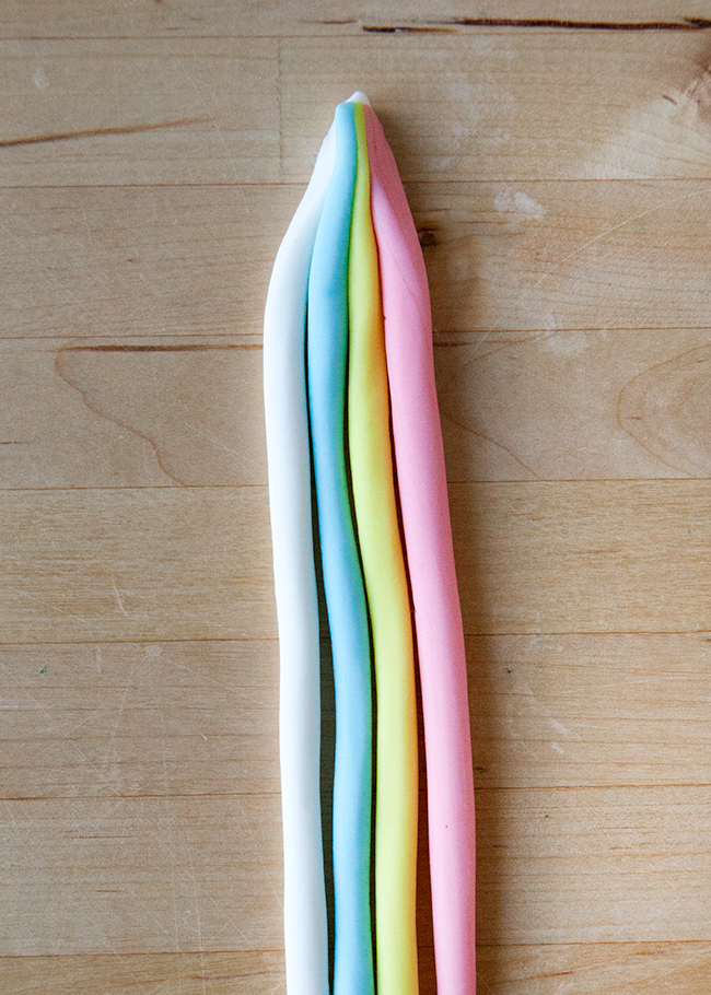 White, blue, yellow and pink fondant ropes