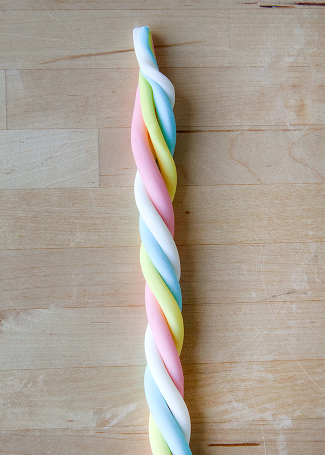 Twisted rainbow colored fondant ropes