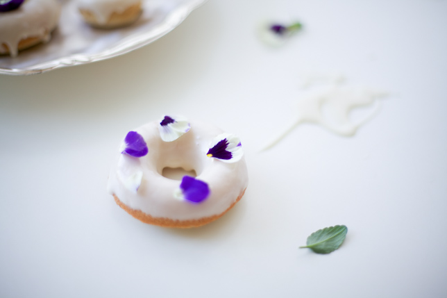 Vanilla Glazed Doughnut Topped with Purple Pansies