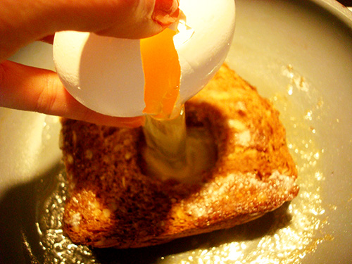 The moment of truth: crack the egg into the hole
