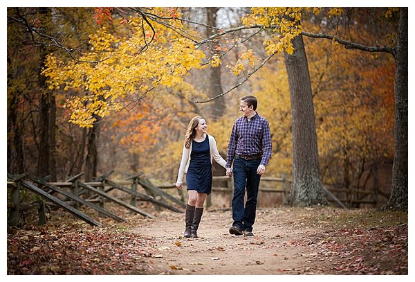 Couple walking down path in autumn 