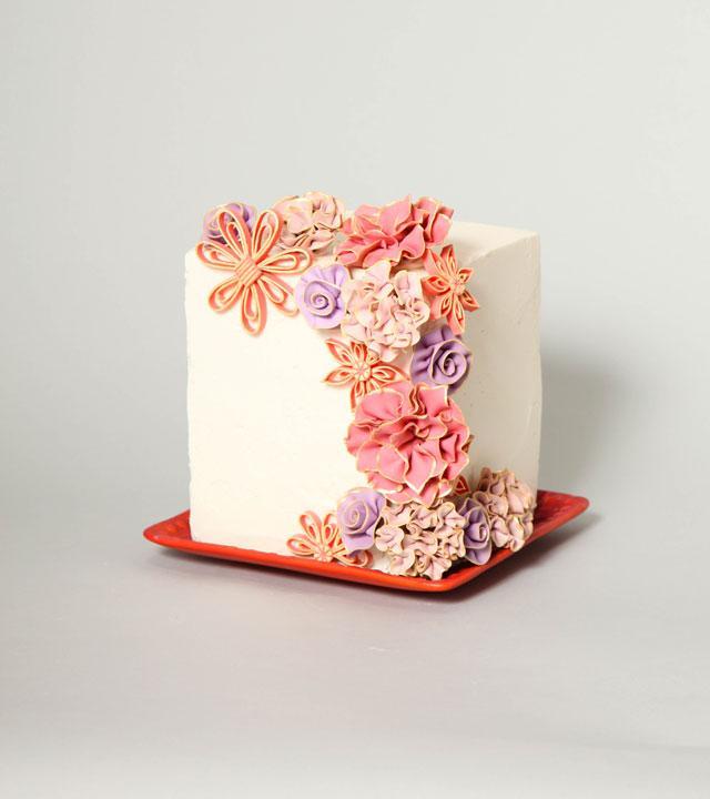 Pink, coral, orange, and violet fantasy flower cake