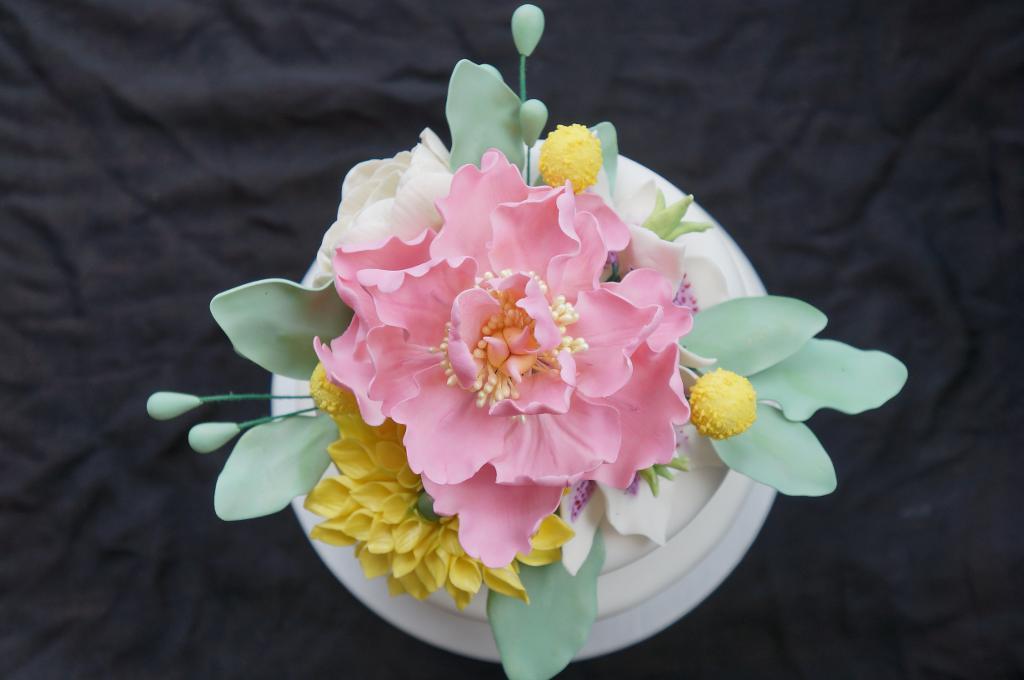 Sugar flower cake with perfect green foliage