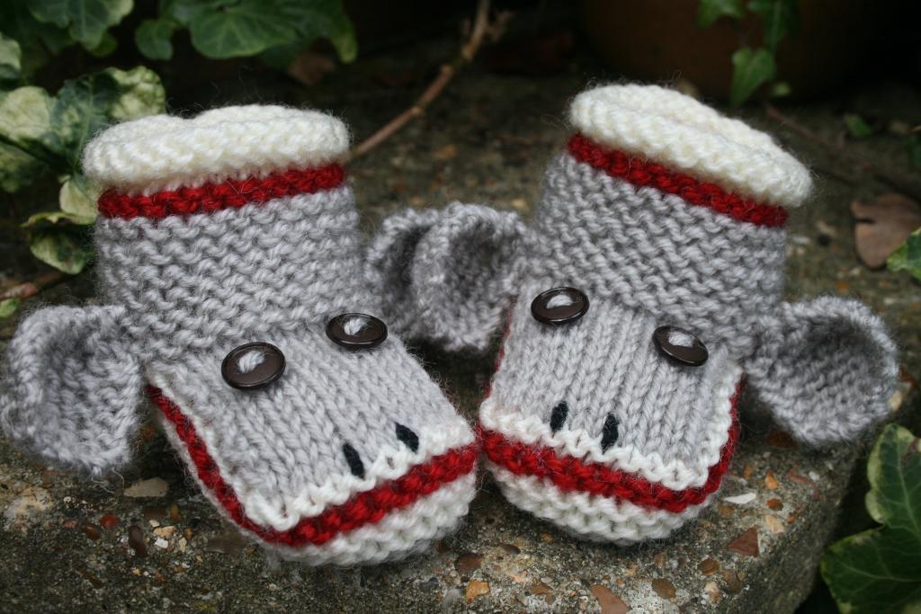 Knitted sock monkey baby booties