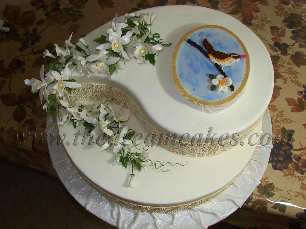 Amazingly intricate quilled bird cake