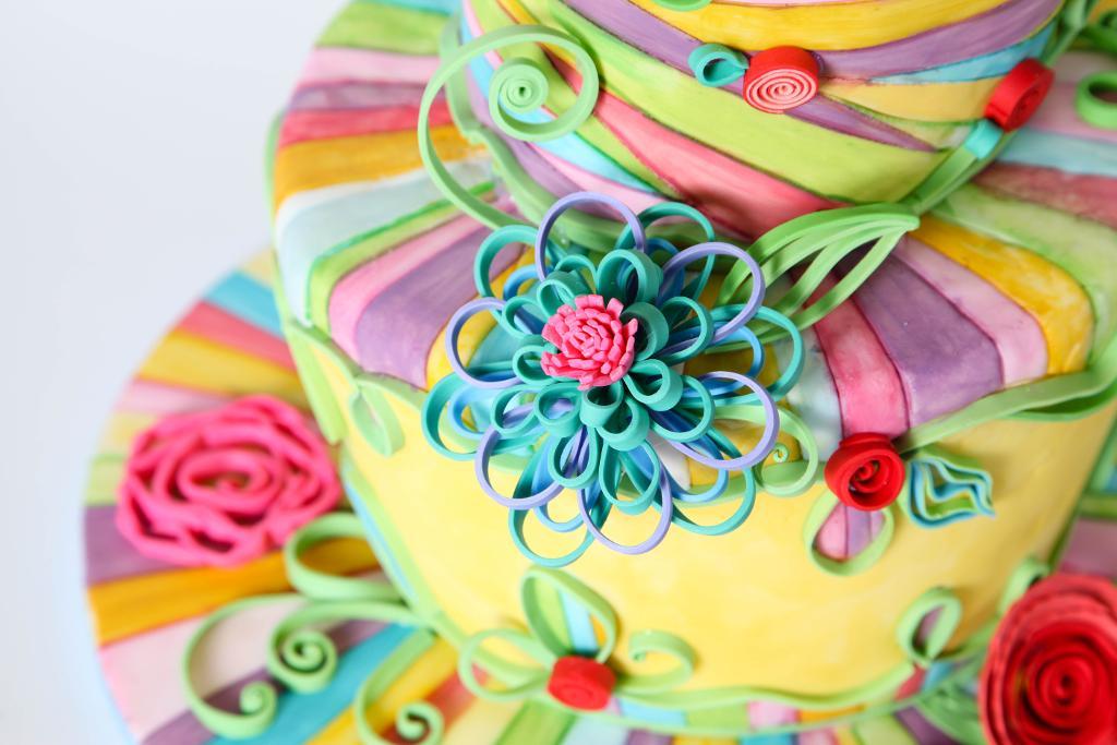 Beautiful swirling rainbow quilled cake