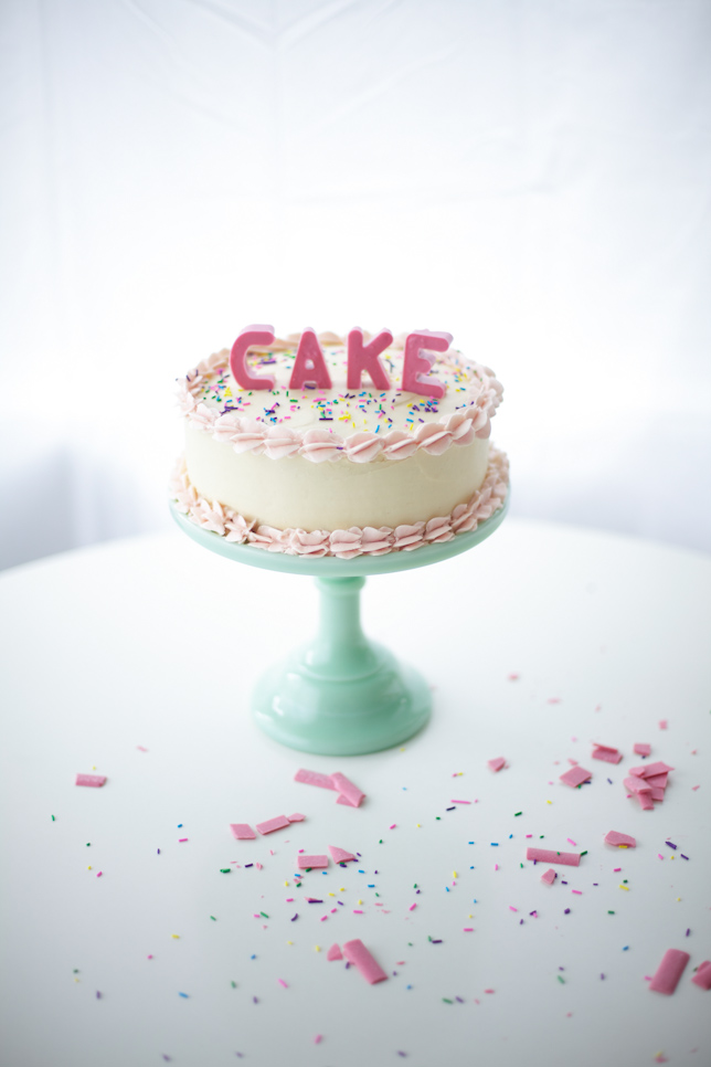 Layer cake with pink edible block letters
