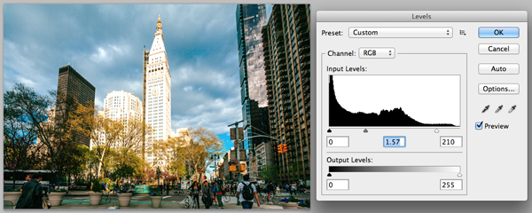 Adjusting levels of the city scene in Photoshop