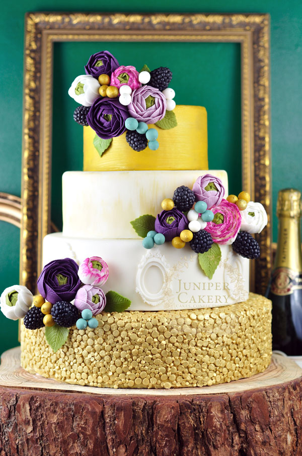 Bright ranunculus wedding cake by Juniper Cakery