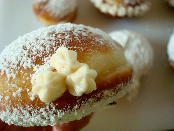 Varying the traditional cream filled doughnut with star-tip decoration 