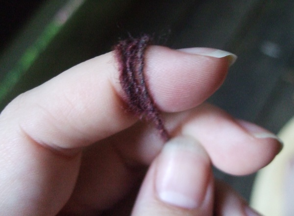 yarn wrapped around a finger
